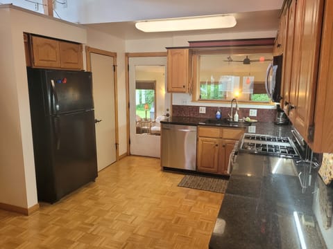KITCHEN:  The home has a modern kitchen with all major appliances including a dishwasher and a good supply of cooking and dining utensils.