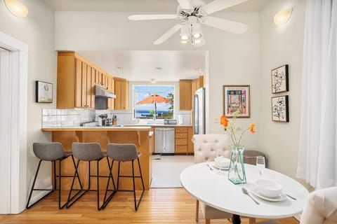 Sip your morning coffee in our charming kitchenette, featuring panoramic views that brighten any day.