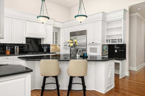 Start your day at the cozy breakfast bar, perfect for casual dining.