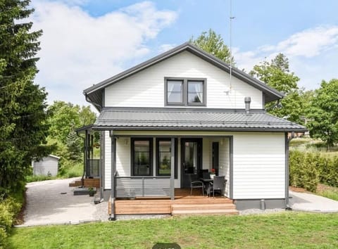 The back terrace with outdoor furniture and a hot tub