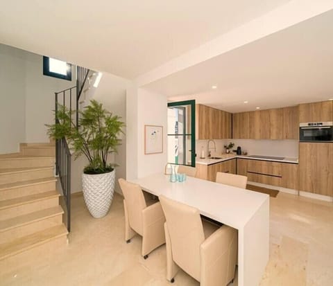 Kitchen and Stairs to Master Bedroom