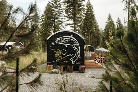 Each cabin provides a unique mural and Montana theme. The FISH HAUS includes it's own patio, hot tub, picnic table and fire pit and Adirondack chairs.
