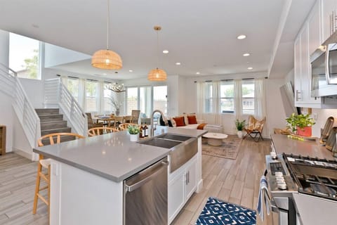 Cozy up in our modern farmhouse with a spacious open-concept living area. Perfect for gathering with loved ones around the kitchen island or relaxing by the fireplace.