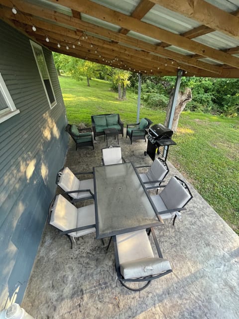 Back porch w dining table, propane grill& relaxing furniture!