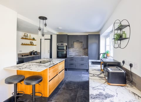 Open plan kitchen/dining area- fully equipped with Oven, hob, dishwasher, microwave Coffee machine