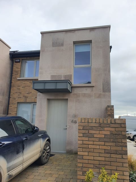 Parking in front of the front door for either two small cars or one large suv.