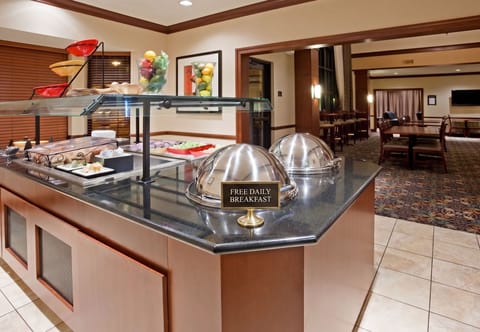 Complimentary breakfast buffet with fresh fruits and hot options.