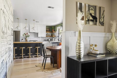 Entryway view leading into the kitchen and dining area