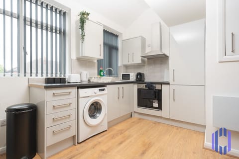 Kitchen. Fully equipped with cooking equipment perfect for families. Appliances such as fridge freezer, microwave, cooker, oven, dishwasher Toaster are free and available for your use.