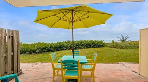 "Relax on the patio only steps away from the beach."