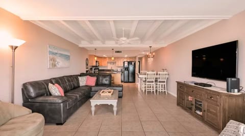 "Cozy up on the comfy couch and watch the waves roll in."