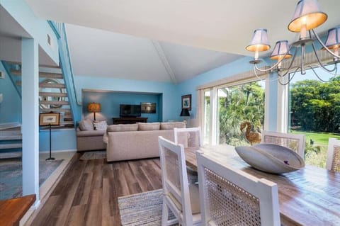 The living area opens to the dining room