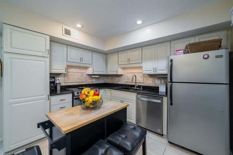 The updated kitchen has granite counters and stainless steel appliances