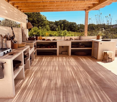 Outdoor Kitchen with charcoal BBQ, gas rings, fridge and sink now covered