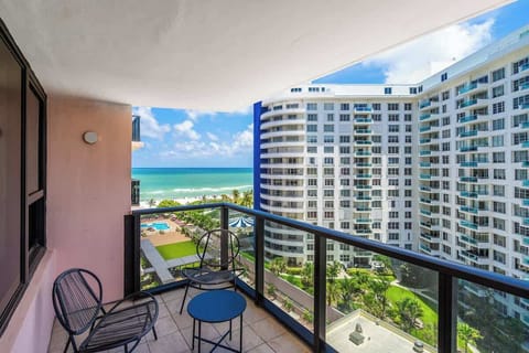 Sip and unwind with ocean views—this Airbnb balcony offers coastal charm and breezy relaxation.