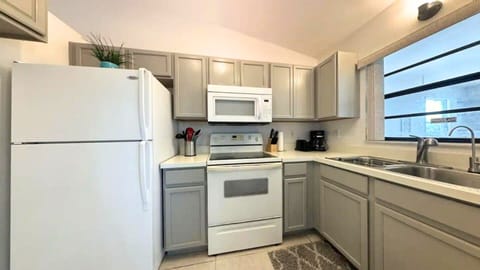 Features essential appliances: refrigerator,stove/oven, dishwasher and many more