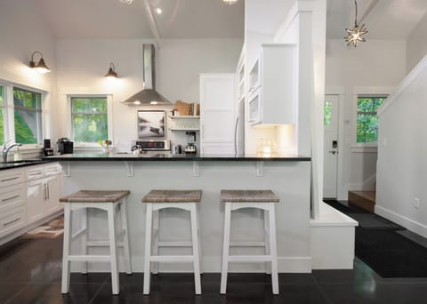 Open concept kitchen with breakfast bar seating, just off the living room 