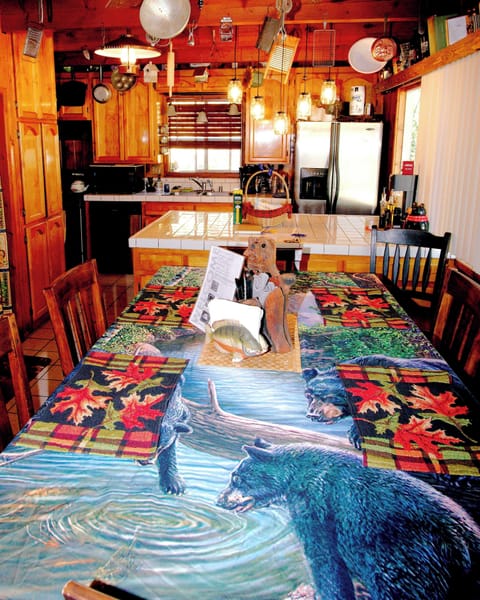 full kitchen with dining table 