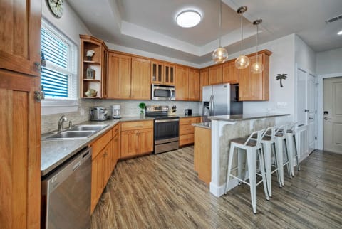 Kitchen is fully equipped and features stainless steel appliances.