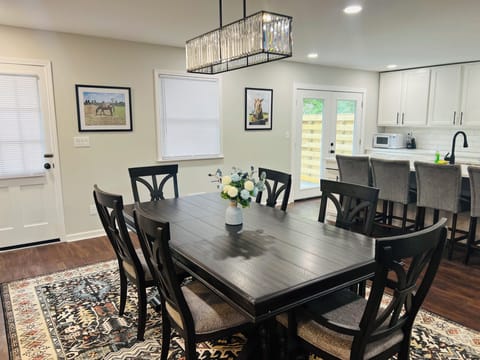 There is a leaf in the hallway closet and extra chairs to make an 8 person table