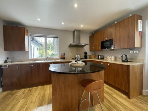 The open plan kitchen and dining area can be accessed from the lounge