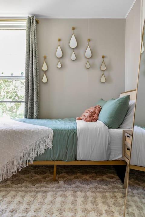 Stylish and spacious queen bedroom with memory foam mattress.