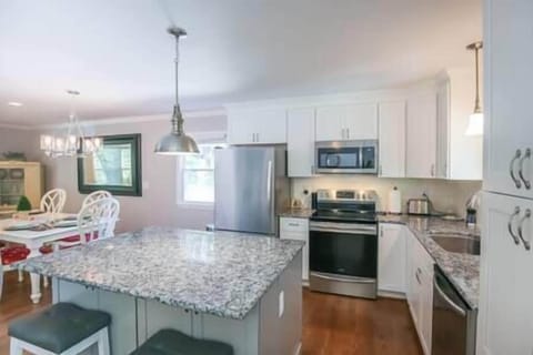 Spacious kitchen opens to dining and living rooms