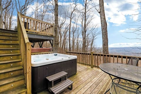 Hot tub on the lower deck with mountain, valley, and sunset views.