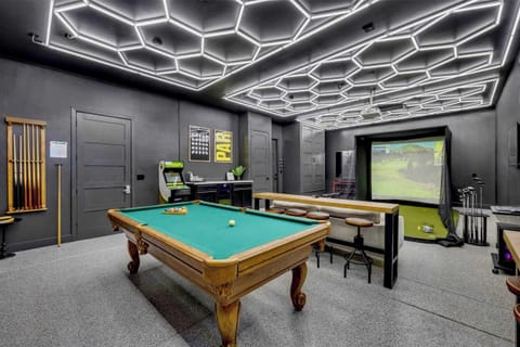 Converted 3-car garage to golf simulator paradise! Full golf simulator with billiards table, great seating, bar area, workout equipment, and Golden Tee arcade!