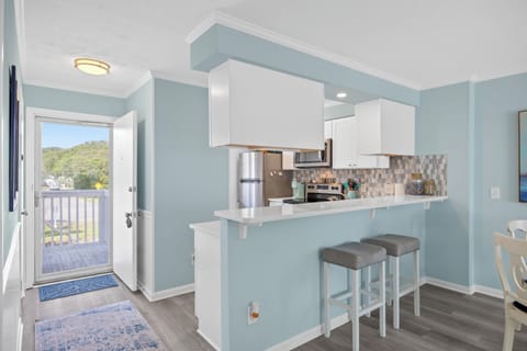 Front door entry way shows extra light, bar area. Indoor pool across the street