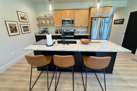 The bar seating is perfect for morning coffee or evening drinks.