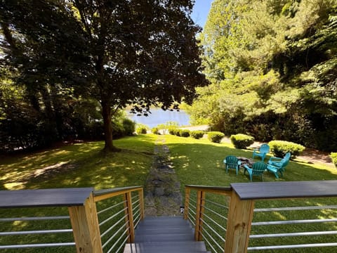 View of the lake with sets going down to the fire pit