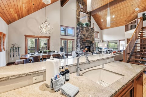 The gorgeous main living space boasts a living room, kitchen, and dining room all seamlessly blended together.