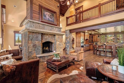 Living Room: Couch, 3 chairs, gas fireplace, open layout with kitchen and private dining area