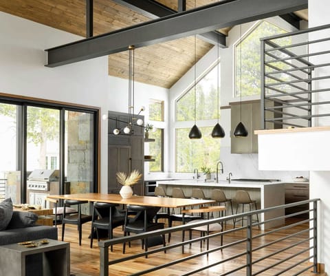 The dining area is situated between the living room and kitchen with a table with seating for 8.