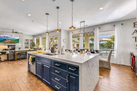 Stunning kitchen with a long island, bar seating, and pendant lighting—perfect for group meals.