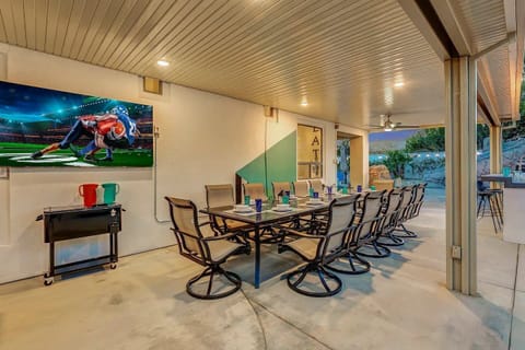 Spacious covered patio with dining, located just steps from the entertainment zone.