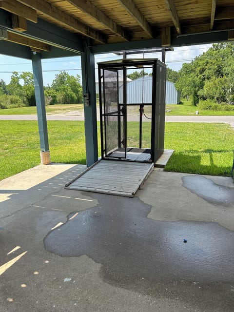 Lower level of home, accommodates two cars under car port