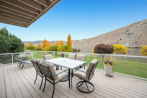Spacious private deck with table seating for 6, 4 loungers, and Blackstone grill
