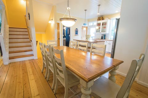 Gather around the farmhouse table for 8, with additional seating at the kitchen island for family and friends.