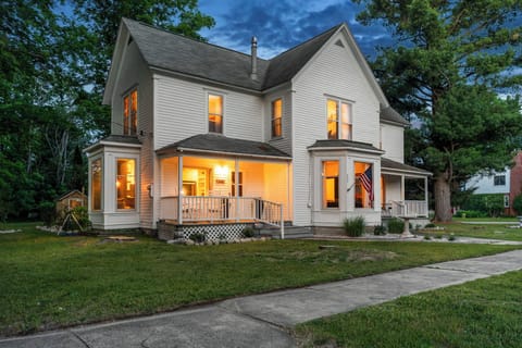 Front of House: Two (2) Porches w/ Rocking Chairs & Two-Person Bistro Set