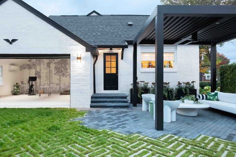 Welcome to Ivy Grace. Where indoor/outdoor living is at its finest. Back entry, pergola and view of studio.