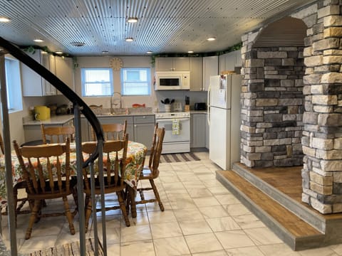 Kitchen, dining area. Step through the arch to the bath, laundry and bedroom.