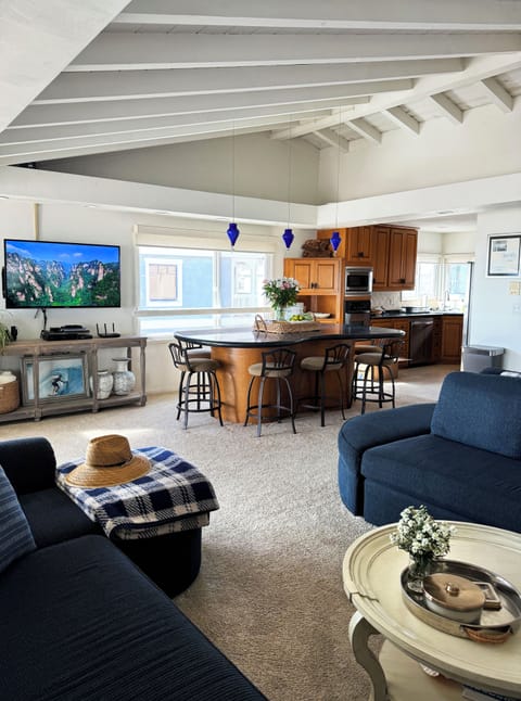 Smart TV and large bar top table for dining