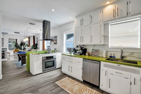 Ample cupboard spaces and hardwood floors for the kitchen
