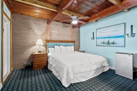 Room 5 is located on the second floor of the Inlet Building. It has a king-size bed and a window with a town view.