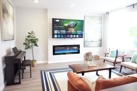 Beautiful decorated living room with 75inch TV that is mounted on mantel mount