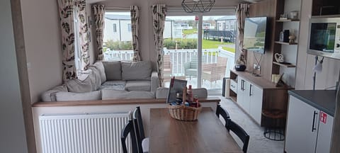 Bright and airy room. With smart tv, cd player, Bluetooth speaker, DVD player, sofa bed, large seating area.