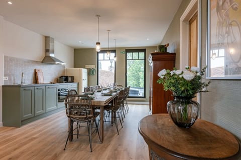 Dining room with open kitchen; perfect for enjoying moments with friends and family