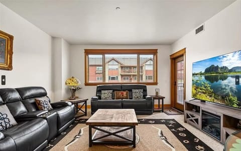 Modern Living Room with Plush Seating and Smart TV and Air Mattress – Perfect for Relaxation